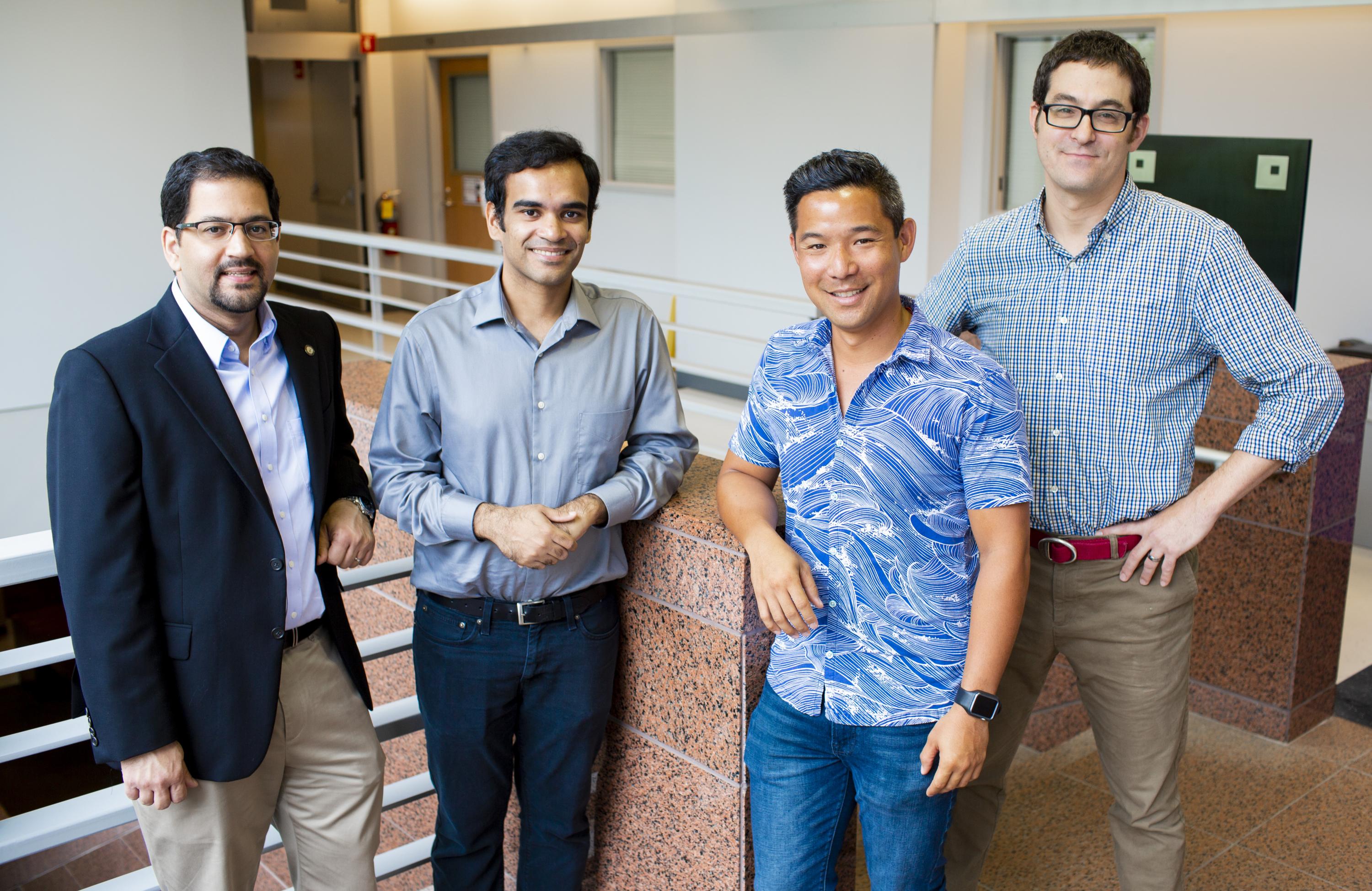 Muhannad Bakir (far left) and Emory's Samuel Sober (far right) combined forces for the project. The work will be led by post-doctoral fellows in their labs, Georgia Tech's Muneeb Zia (center left) and Emory's Bryce Chung (center right).