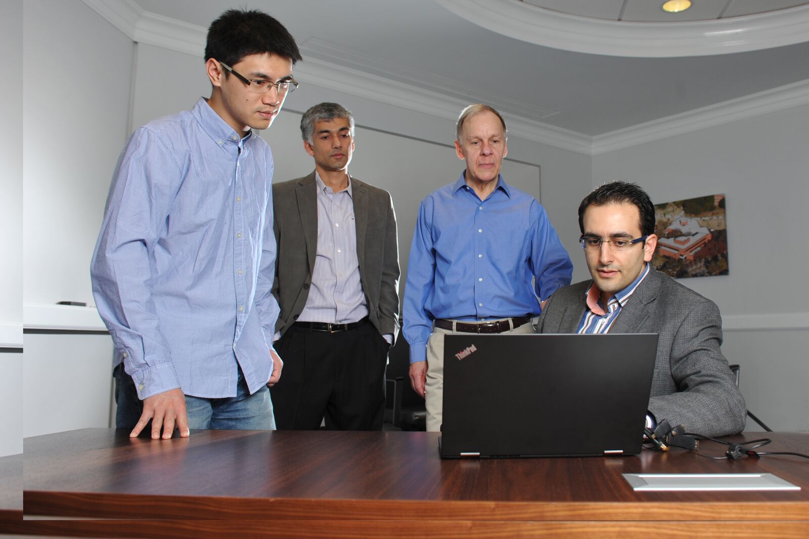 ISyE researchers partner with American Red Cross on project that has been selected as a Franz Edelman Award finalist. From left to right: ISyE Ph.D. student Can Zhang, Professor Roshan Vengazhiyil, Schneider National Chair in Transportation and Logistics Chelsea White III, and George Family Foundation Assistant Professor Turgay Ayer