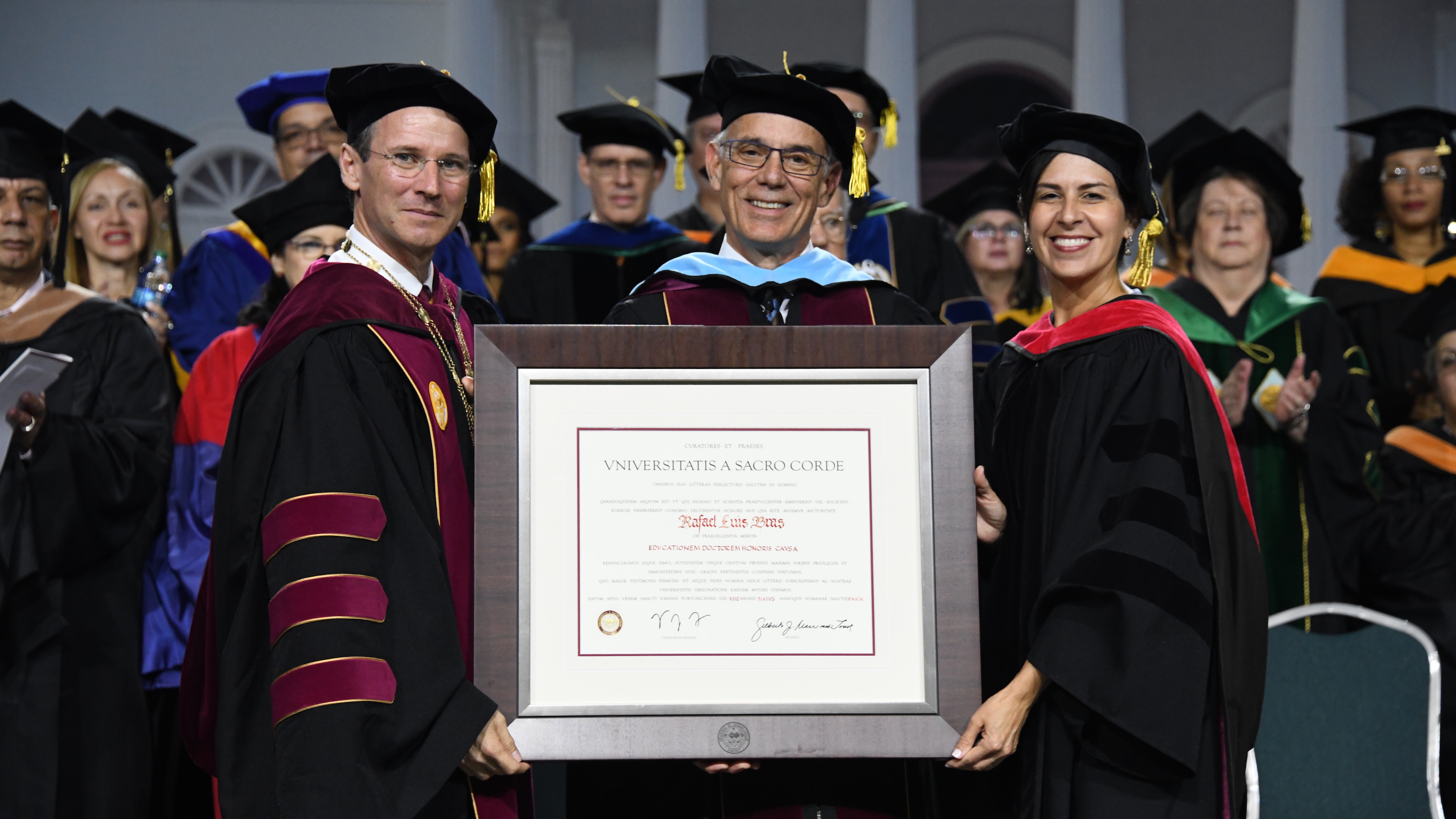 Rafael L. Bras Awarded Honorary Degree at Universidad del Sagrado Corazón, May 2019. Pictured with Gilberto Marxuach-Torrós, President of Sagrado Corazón University and Vanessa Lugo-Flores, President of the Board of Trustees, Sagrado Corazón University.