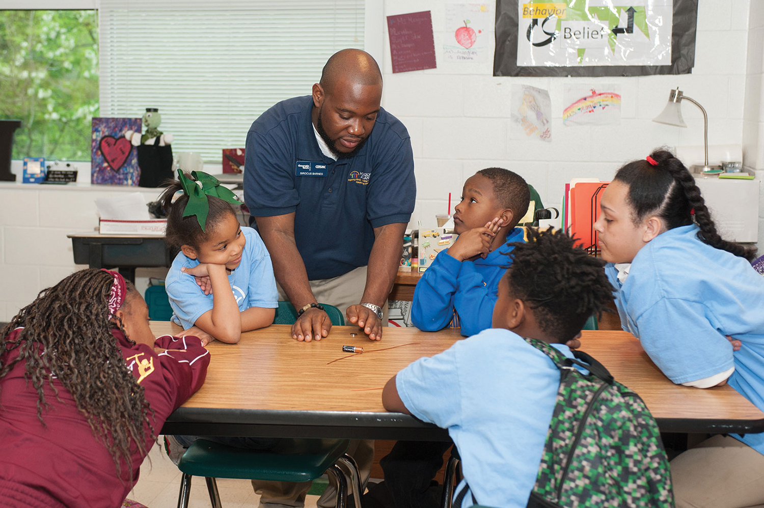 Sirocus Barnes gives instruction in an extracurricular science and technology class at Drew Charter School.